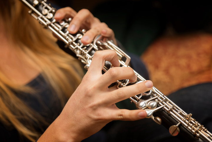 Oboe player [Source: Adobe Free Stock Image]
