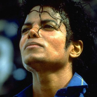 Michael Jackson in  , after several cosmetic surgeries. In this picture, his skin is fairly dark, although photographs taken earlier in the year show it significantly whiter (most notably, the Bad album cover). Photographs from this era show noticeably different skin tones, suggesting that heavy makeuping was used to achieve Jackson's skin tone and  facial features during this period.
